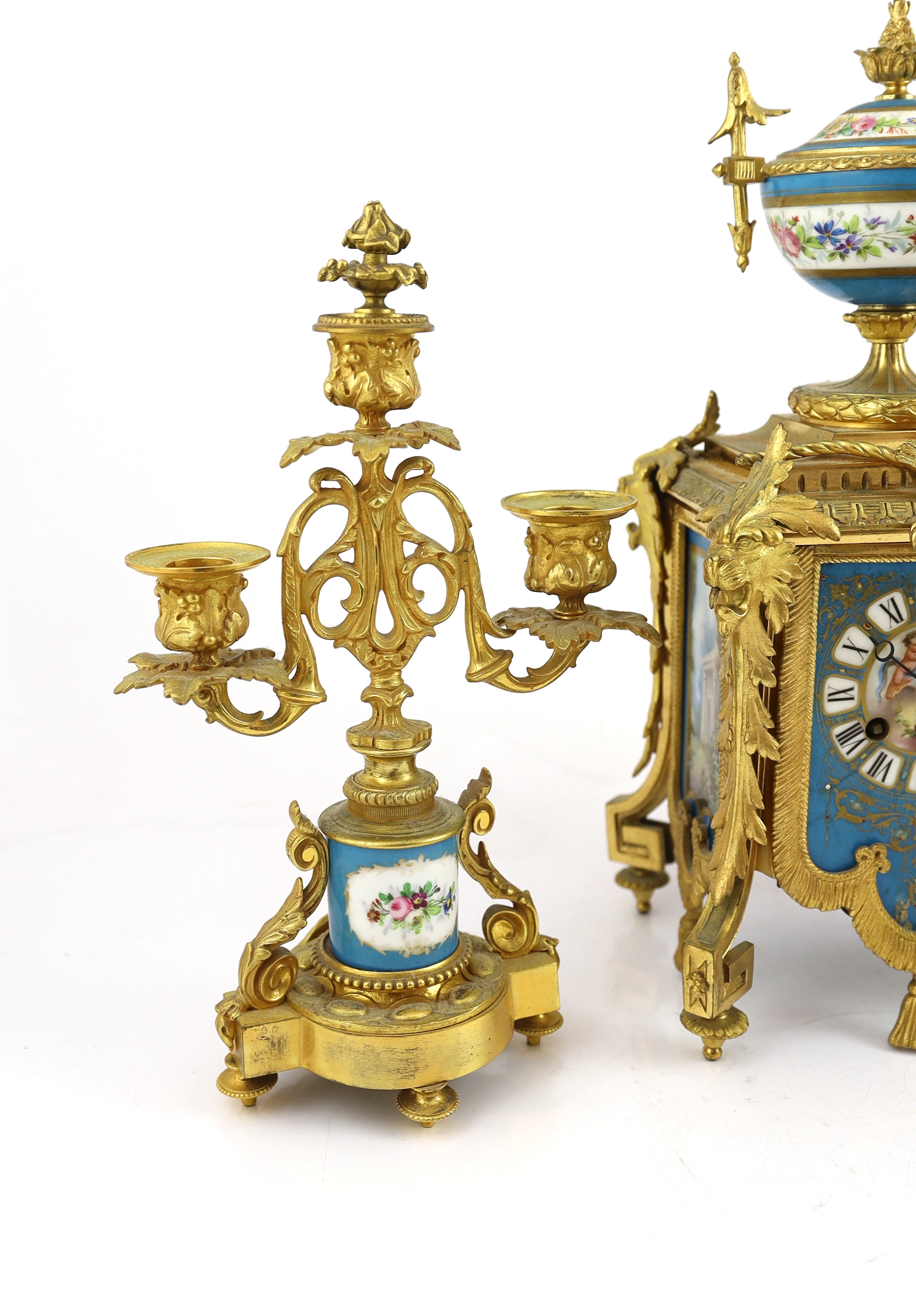 A 19th century French ormolu and Sevres style porcelain clock garniture, clock 19cm wide, 15cm deep, 37cm high candelabra 19cm wide, 30.5cm high
